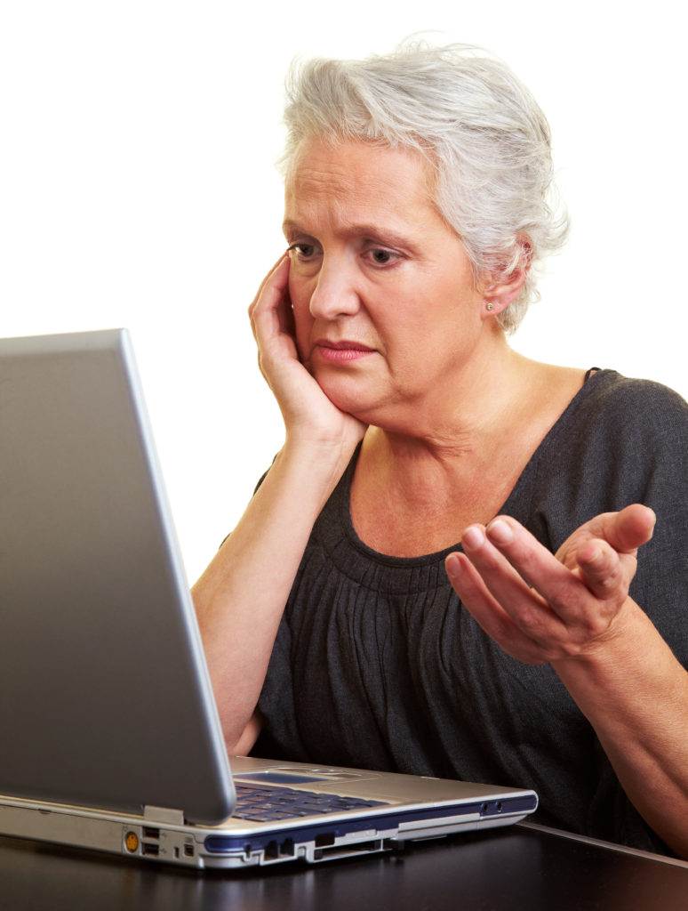 Woman frustrated in front of laptop